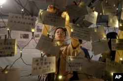 People leave messages during a candlelight vigil at Democracy Square in Taipei, Taiwan, June 4, 2023, to mark the 34th anniversary of the Chinese military crackdown on the pro-democracy movement in Beijing's Tiananmen Square.