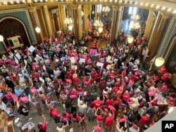 Iowa Democrat Jennifer Konfrst speaks to protesters rallying at the Iowa Capitol rotunda in opposition to the new ban on abortion after roughly six weeks of pregnancy introduced by Republican lawmakers in a special session on July 11, 2023.