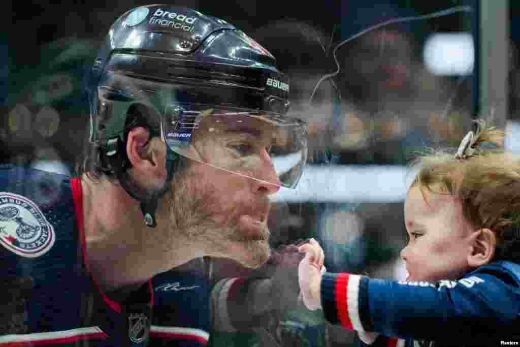 Columbus Blue Jackets defenseman Erik Gudbranson makes faces with his daughter during warmups before a game against the Philadelphia Flyers at Nationwide Arena, in Columbus, Ohio, Oct. 12, 2023. (Aaron Doster/USA Today Sports)