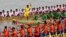 Participants row dragon boats during a competition as part of the Water Festival on the Tonle Sap river in Phnom Penh on November 26, 2023.