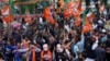 Supporters of India's ruling Bharatiya Janata Party, or BJP, celebrate early leads for the party in Rajasthan state elections in Jaipur, India, Dec.3, 2023.