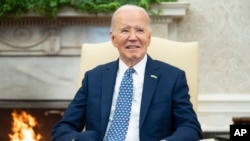 FILE - President Joe Biden speaks in the Oval Office of the White House, Feb. 27, 2024, in Washington. Biden on Feb. 28 is signing an executive order aiming to better protect Americans' personal data on everything from foreign adversaries like China and Russia.