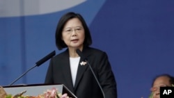 FILE - Taiwan's President Tsai Ing-wen speaks in front of the Presidential Building in Taipei, Taiwan, Oct. 10, 2023.