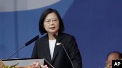 FILE - Taiwan's President Tsai Ing-wen speaks in front of the Presidential Building in Taipei, Taiwan, Oct. 10, 2023. 