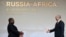 Mozambique President Filipe Nyusi, left, is greeted by Russian President Vladimir Putin during the official welcome ceremony for heads of delegations of countries taking part in the Russia Africa Summit in St. Petersburg, Russia, July 27, 2023.