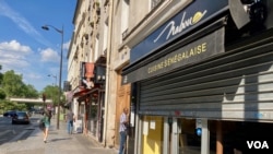 Ethnic restaurants in northeastern Paris. A new study finds immigrants are faring better finding jobs than a decade ago. (Lisa Bryant/VOA)