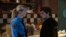 This image released by Universal Pictures shows Elizabeth Lali and Josh Hutcherson in a scene from "Five Nights at Freddy's."  (Universal Pictures via AP)