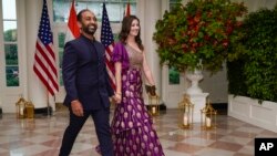 Sameer Patel and Shannon Patel arrive for the state dinner with President Joe Biden and India's Prime Minister Narendra Modi at the White House, June 22, 2023, in Washington.