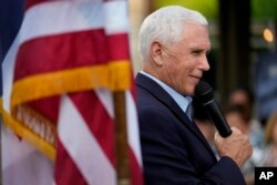 FILE - Former Vice President Mike Pence speaks to local residents during a meet and greet in Des Moines, Iowa, May 23, 2023.