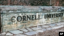 FILE - A Cornell University sign is seen on campus, Jan. 14, 2022, in Ithaca, N.Y. Patrick Dai, a former Cornell student arrested for posting threats against Jews on campus in fall 2023, was sentenced to 21 months in prison on Aug. 12, 2024.