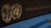 FILE - The logo of the International Court of Justice, left, and that of the U.N., right, are seen on the judges bench at the International Court of Justice, or World Court, in The Hague, Netherlands, Oct. 12, 2023. 