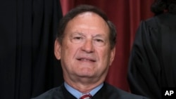 FILE - Associate Justice Samuel Alito joins other members of the Supreme Court as they pose for a new group portrait, at the Supreme Court building in Washington, Oct. 7, 2022. 