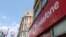 FILE - Branding is displayed for Vodafone at one of its stores in London, Britain, June 14, 2023.