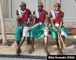 Participants from the African region in indigenous attire rest after a hectic day at COP28 in Dubai, United Arab Emirates, on Dec. 6, 2023.