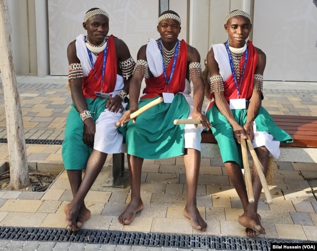 Participants from the African region in indigenous attire rest after a hectic day at COP28 in Dubai, United Arab Emirates, on Dec. 6, 2023.