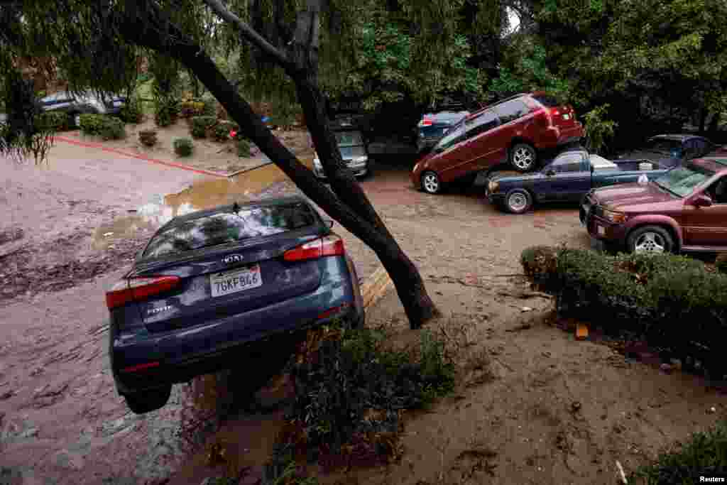 Damage is shown after a heavy rain storm causes a small river to overflow into a neighborhood in San Diego, California, Jan. 22, 2024. 