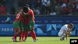 Morocco's players celebrate after winning their men's quarterfinal soccer match 4-0 over the U.S. at the Paris 2024 Olympic Games at the Parc des Princes in Paris on Aug. 2, 2024.