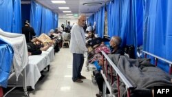 FILE - Patients and internally displaced people are pictured at Shifa hospital in Gaza City on Nov. 10, 2023, amid ongoing battles between Israel and Hamas. Israel says Hamas militants established a command center under the hospital.