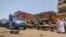 Sudanese police patrol the main market of Wad Madani, 200 km south of Khartoum, June 24, 2023. The United Nations says nearly 1.5 million people have fled the capital since violence erupted in mid-April.