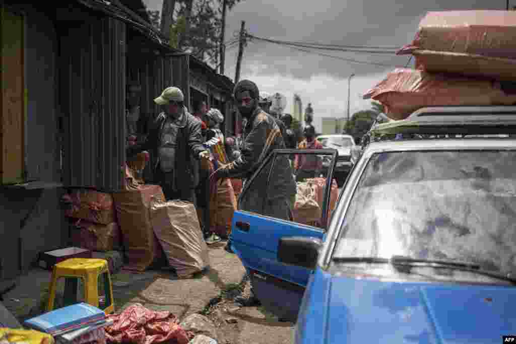 People clear out street stalls before a planned demolition in the historical Piazza neighbourhood of Addis Ababa, Ethiopia.