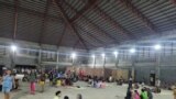 People gather at an evacuation center in the aftermath of an earthquake in Hinatuan, Philippines, Dec. 2, 2023. 