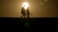 FILE - People walk along a trail at sunset, July 16, 2023, in Death Valley National Park, Calif. A new study finds the intense hot spells gripping much the American Southwest and Southern Europe could not have occurred without climate change.