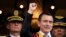 Newly sworn-in President Daniel Noboa waves from a balcony of the Carondelet presidential palace in Quito, Ecuador, Nov. 23, 2023. 