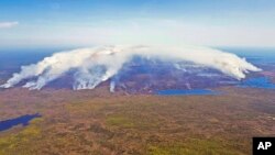 FILE - Wildfires burn in Shelburne County, Nova Scotia, May 31, 2023. (Communications Nova Scotia/The Canadian Press via AP)