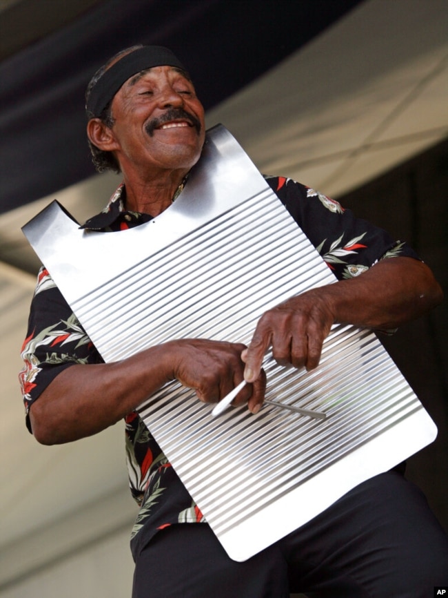 FILE - Morris Francis of the Creole Zydeco Farmers performs during the 2008 New Orleans Jazz & Heritage Festival at the New Orleans Fairgrounds Racetrack in New Orleans, May 1, 2008. (AP Photo/Dave Martin)