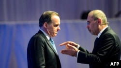 Jordanian Deputy Prime Minister and Foreign Minister Ayman Safadi, right, and US National Security Council Coordinator for the Middle East and North Africa Brett McGurk, talk during the IISS Manama Dialogue security conference, in Manama, Nov. 18, 2023.