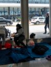 Migrants stay in a makeshift shelter at O'Hare International Airport, Sept. 20, 2023, in Chicago. 