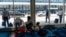 Migrants stay in a makeshift shelter at O'Hare International Airport, Sept. 20, 2023, in Chicago. 