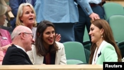 Nazanin Zaghari-Ratcliffe, center, chats with Catherine, Princess of Wales, in the royal box on Center Court at Wimbledon on July 4, 2023. Zaghari-Ratcliffe was invited to the event by tennis star and past Wimbledon champion Andy Murray.