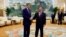 U.S. Special Presidential Envoy for Climate John Kerry, left, and Chinese Premier Li Qiang shake hands before a meeting at the Great Hall of the People in Beijing, July 18, 2023. 