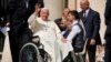 FILE - Pope Francis waves as he leaves after his weekly general audience in St. Peter's Square, at the Vatican, Aug. 28, 2024. 