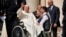 FILE - Pope Francis waves as he leaves after his weekly general audience in St. Peter's Square, at the Vatican, Aug. 28, 2024. 