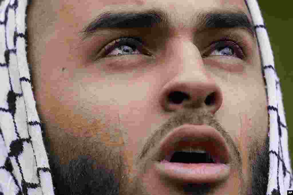 A Muslim community member mourns Wadea Al Fayoume at his grave in LaGrange, Illinois, Oct. 16, 2023.&nbsp;An Illinois landlord accused of fatally stabbing the six-year-old Muslim boy and seriously wounding his mother was charged with a hate crime after police and relatives said he singled out the victims because of their faith and as a response to the war between Israel and Hamas.&nbsp;(AP Photo/Nam Y. Huh)