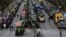 Tractors and trucks stand in a street during a protest of farmers and truck drivers, Jan. 15, 2024 in Berlin, Germany. 