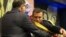 National Assembly President Henry Kronfle places the presidential sash on President Daniel Noboa after he was sworn in as the country's new president, during his inauguration ceremony at the National Assembly, in Quito, Ecuador, Nov. 23, 2023. 