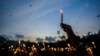 Women hold candles as they stage a protest the rape and killing of a trainee doctor at a government hospital last week, in Guwahati, India, Aug. 16, 2024.