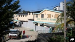 FILE - The entrance at the Fontaine Hospital Center is seen in a slum of Port-au-Prince, Haiti, Jan. 23, 2023. An armed gang surrounded the facility on Nov. 15, trapping in it scores of women, children and newborns, according to its director.