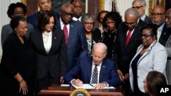 President Joe Biden signs a proclamation to establish the Emmett Till and Mamie Till-Mobley National Monument, in the Indian Treaty Room on the White House campus, in Washington, July 25, 2023.
