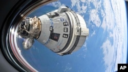 This NASA image shows Boeing's Starliner spacecraft, which launched astronauts Butch Wilmore and Suni Williams to the International Space Station in June. (NASA via AP)