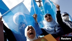 Ethnic Uyghurs holding East Turkestan flags take part in a protest against China to mark the 14th anniversary of Urumqi riots, in Istanbul, Turkey, July 5, 2023.