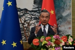 FILE - Chinese Foreign Minister Wang Yi attends EU-China High-Level Strategic Dialogue at the Diaoyutai State Guest House in Beijing, China, Oct. 13, 2023.