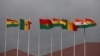 FILE - National flags of the Economic Community of West African States (ECOWAS) member states fly at Kotoka Internatinal Airport in Accra, Ghana, Sept. 15, 2020.