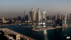 FILE - Luxury towers dominate the skyline in the Dubai Marina district in United Arab Emirates, on April 6, 2021. 