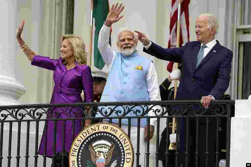 First lady Jill Biden, India's Prime Minister Narendra Modi and President Joe Biden wave from the Blue Room Balcony during a State Arrival Ceremony on the South Lawn of the White House in Washington.