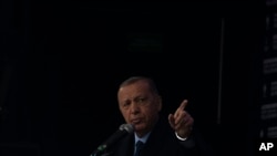 FILE - People's Alliance's presidential candidate Recep Tayyip Erdogan speaks to his supporters during an election rally in Istanbul, Turkey, May 12, 2023.