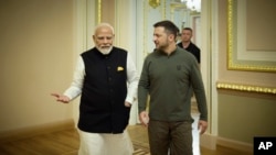 FILE - In this photo provided by the Ukrainian Presidential Press Office, Indian Prime Minister Narendra Modi, left, speaks with Ukrainian President Volodymyr Zelenskyy, in Kyiv, Ukraine, Aug. 23, 2024.